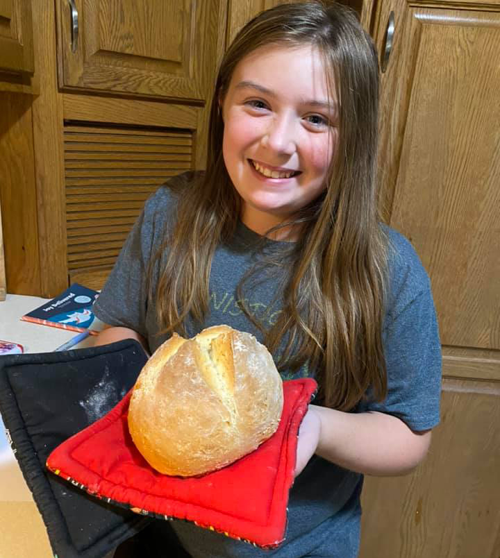 Girl holding Irish soda bread